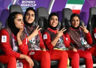 iran team captain zahra ghanbari mona hamoudi and atefeh ramazanzadeh react from the bench during the afc women s asian cup group a match between iran and philippines photo afp