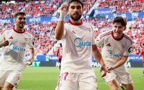 struggling sevilla suffer late blow