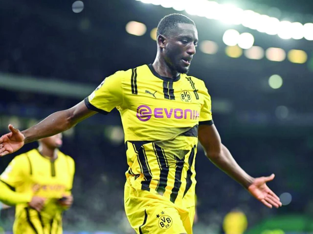 borussia dortmund s guinean forward sehrou guirassy celebrates scoring his team s first goal at sporting lisbon photo afp borussia dortmund s guinean forward sehrou guirassy celebrates scoring his team s first goal at sporting lisbon photo afp