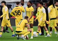 ac milan s french forward christopher nkunku centre and teammates react at the end of the italian serie a match against atalanta in milan photo afp