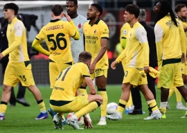 ac milan s french forward christopher nkunku centre and teammates react at the end of the italian serie a match against atalanta in milan photo afp