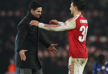 arsenal manager mikel arteta embraces martin zubimendi after the league cup semi final photo afp