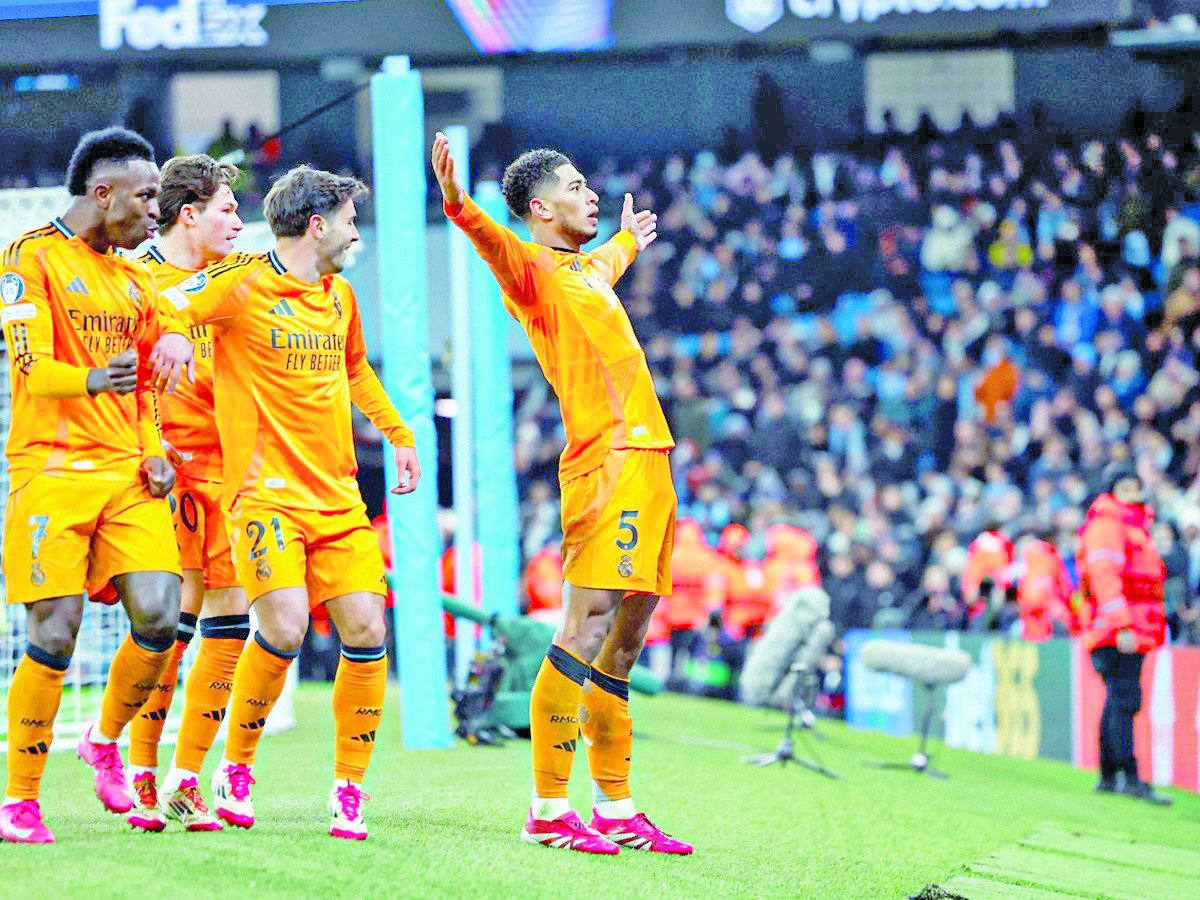 jude bellingham slides in to score the winning goal for real madrid in stoppage time photo afp