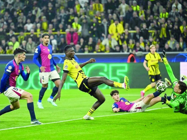 serhou guirassy r scored a hat trick but was unable to help his side come back against barcelona photo afp serhou guirassy r scored a hat trick but was unable to help his side come back against barcelona photo afp