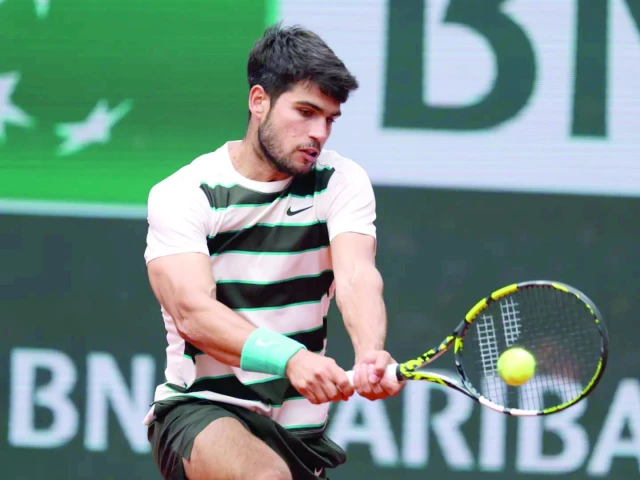 carlos alcaraz powered into the french open second round after defeating italy s giulio zeppieri photo afp carlos alcaraz powered into the french open second round after defeating italy s giulio zeppieri photo afp