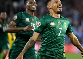 oswin appollis r celebrates scoring to give south africa victory over zimbabwe in marrakesh photo afp