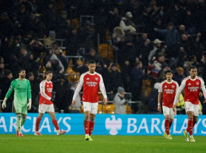 arsenal blow two goal lead in wolves draw
