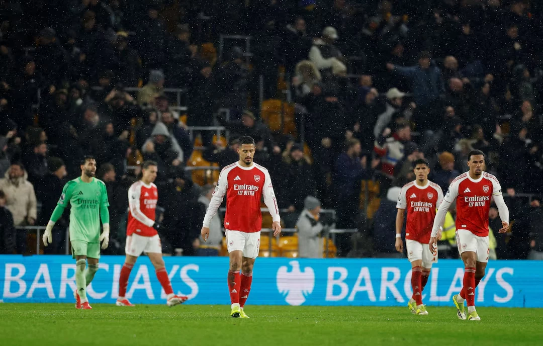 arsenal s william saliba and arsenal s gabriel magalhaes react after wolverhampton wanderers tom edozie scored their second goal photo reuters