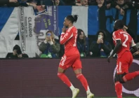 michael olise celebrates scoring bayern munich s second goal in tuesday s thumping of atalanta photo afp