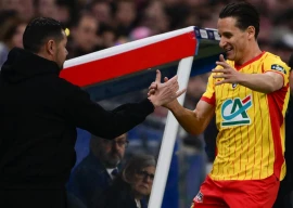 florian thauvin celebrates a goal with lens coach pierre sage photo afp file