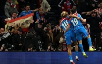 atletico survive spurs scare