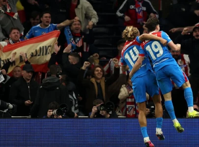 atletico survive spurs scare