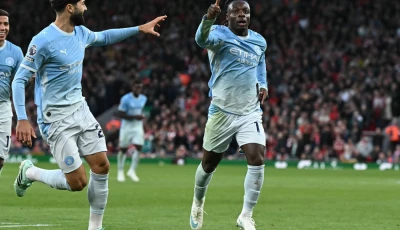 manchester city s jeremy doku celebrates after scoring their second goal during the premier league match against liverpool at anfield on sunday photo afp