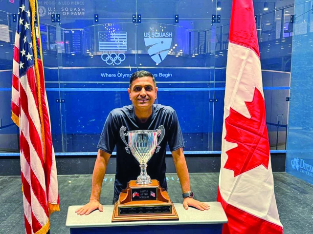 faheem khan is posing with the prestigious battle of the border tournament trophy photo app