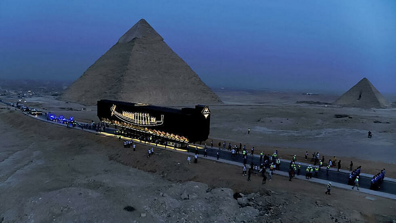 khufu s solar boat on its journey to the new grand egyptian museum photo afp