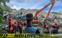 at least two dead as garbage landslide buries dozens in central philippines at least two dead as garbage landslide buries dozens in central philippines