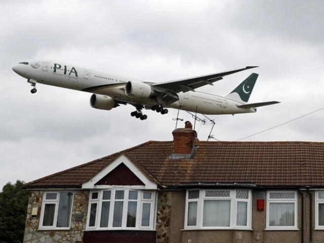 a pakistan international airlines pia boeing 777 comes in over houses to land at heathrow airport in west london on june 8 2020 photo afp a pakistan international airlines pia boeing 777 comes in over houses to land at heathrow airport in west london on june 8 2020 photo afp