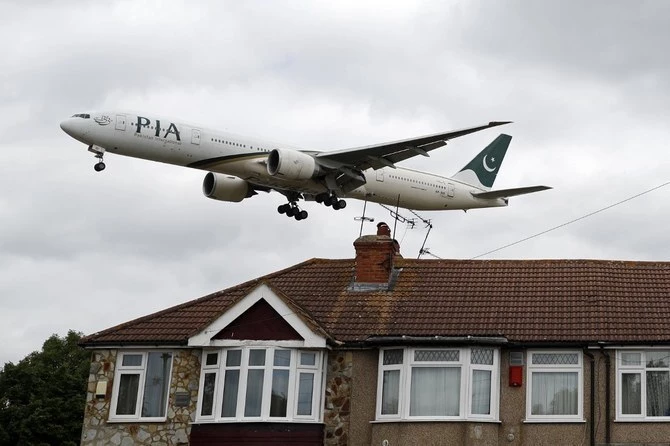 a pakistan international airlines pia boeing 777 comes in over houses to land at heathrow airport in west london on june 8 2020 photo afp a pakistan international airlines pia boeing 777 comes in over houses to land at heathrow airport in west london on june 8 2020 photo afp