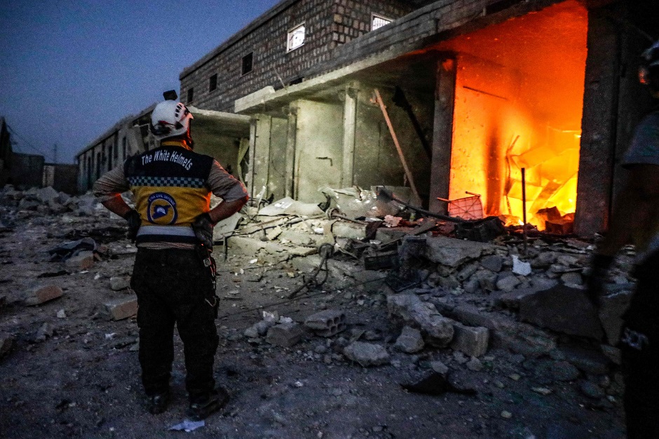 A member of the Syrian Civil Defence, also known as the 