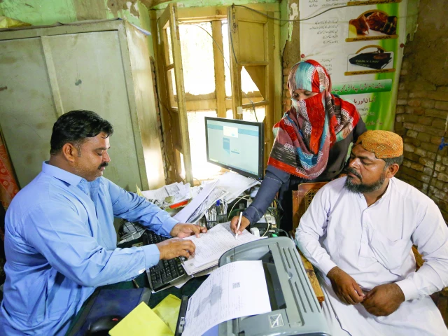 misbah dilshad submits her family data form in municipal committee office in punjab s rajanpur district photo afp misbah dilshad submits her family data form in municipal committee office in punjab s rajanpur district photo afp