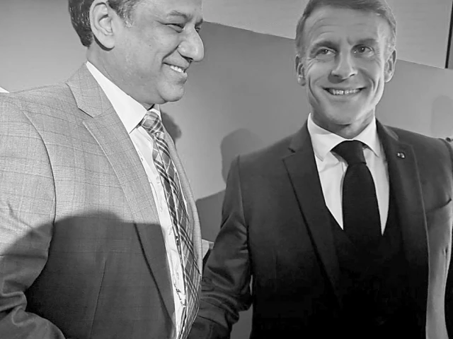 senator khalil tahir sandhu shakes hands with french president emmanuel macron during a meeting in paris photo express senator khalil tahir sandhu shakes hands with french president emmanuel macron during a meeting in paris photo express