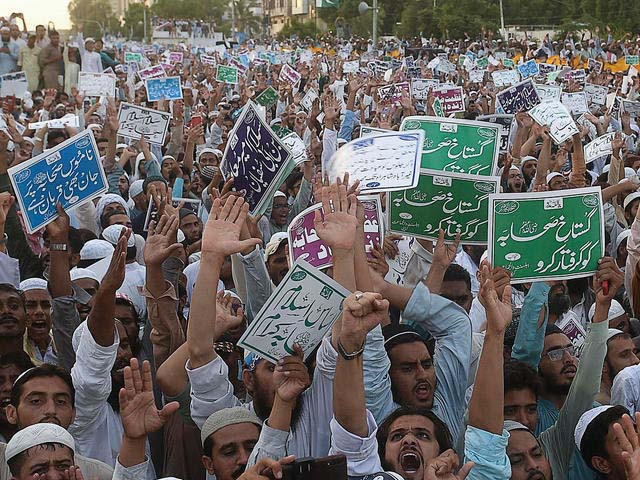 sunni muslim demonstrators shout slogans during an anti shia protest in karachi photo afp