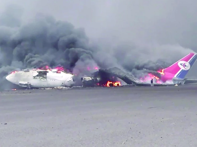 an airplane at sanaa international airport engulfed in flames photo afp an airplane at sanaa international airport engulfed in flames photo afp