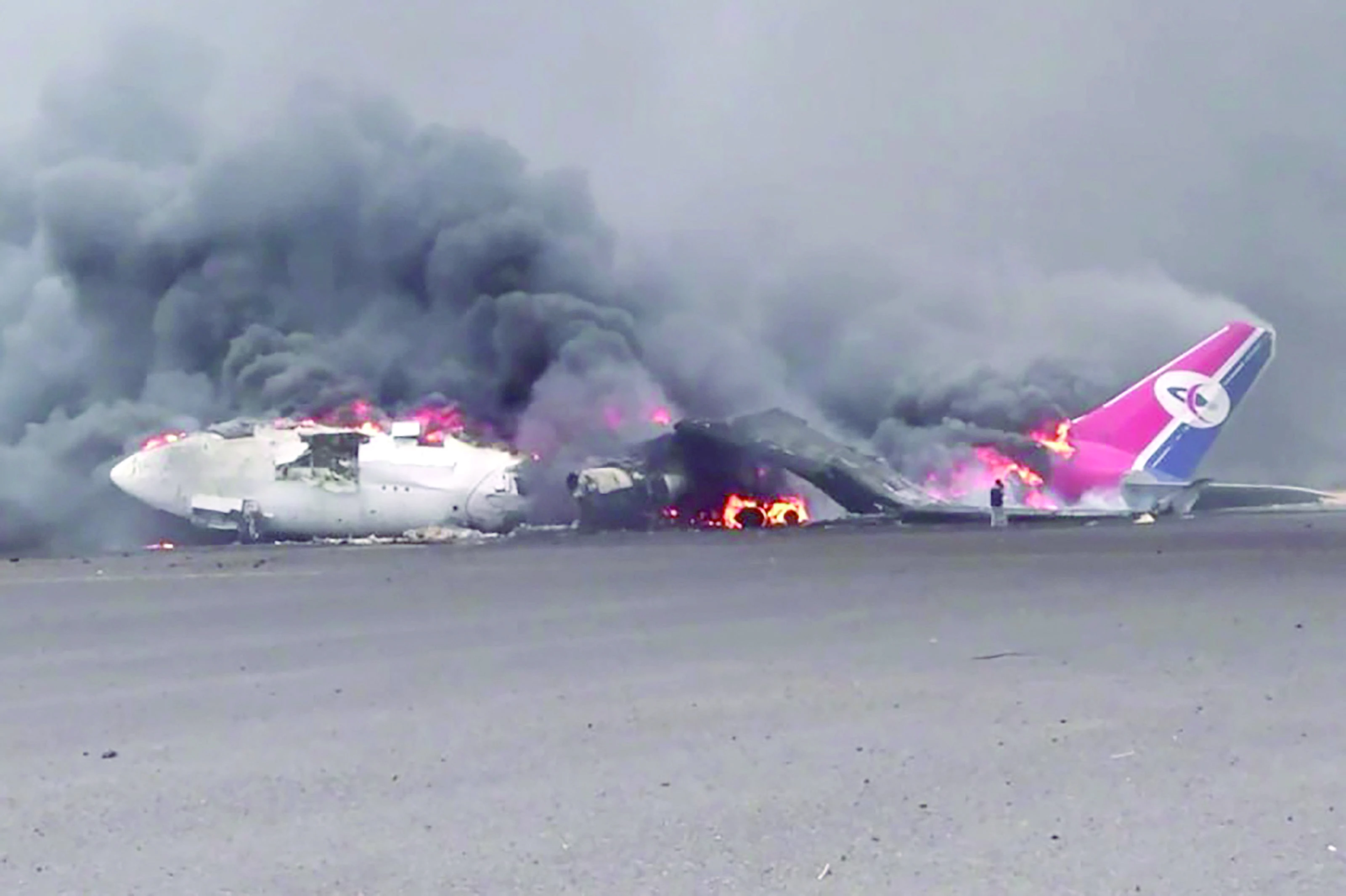 an airplane at sanaa international airport engulfed in flames photo afp an airplane at sanaa international airport engulfed in flames photo afp