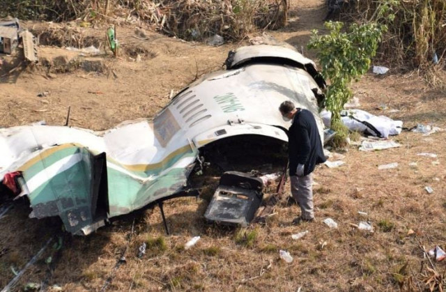 a member of french investigating team investigates the wreckage of a yeti airlines operated aircraft in pokhara nepal january 18 2023 photo reuters a member of french investigating team investigates the wreckage of a yeti airlines operated aircraft in pokhara nepal january 18 2023 photo reuters