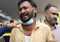 a man in tears outside the pims maternity ward where a fire killed more than a dozen infants photo afp a man in tears outside the pims maternity ward where a fire killed more than a dozen infants photo afp