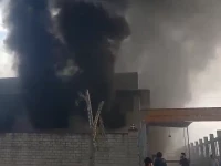 thick plumes of smoke billow from a textile factory that caught fire in rawalpindi s industrial estate on february 9 photo screengrab