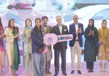 Pink electric scooters lined up for distribution