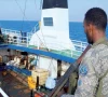 a puntland maritime police force soldier stands aboard the mt honour 25 oil tanker following its rescue off somalia photo x pmpfofficial