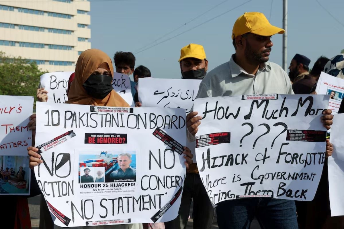 Families of the Pakistani hostage crew members of the Oil Products Tanker the HONOUR 25 that was hijacked by pirates off the coast of Somalia, hold placards during a protest, calling the government to take immediate action for the safe return of their loved ones, in Karachi, Pakistan May 13, 2026. REUTERS