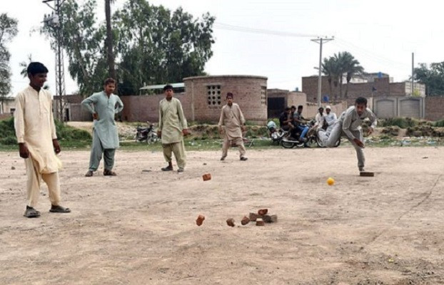 a group of youngsters play pittu garam in a local ground in multan app file