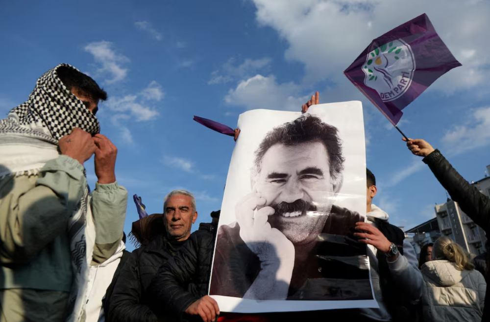 a demonstrator holds a picture of jailed kurdish militant leader abdullah ocalan during a rally in diyarbakir turkey february 27 2025 photo reuters