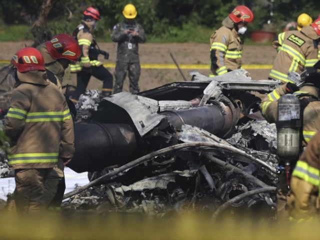 south koreans firefighters work at the plane crash site photo ap south koreans firefighters work at the plane crash site photo ap
