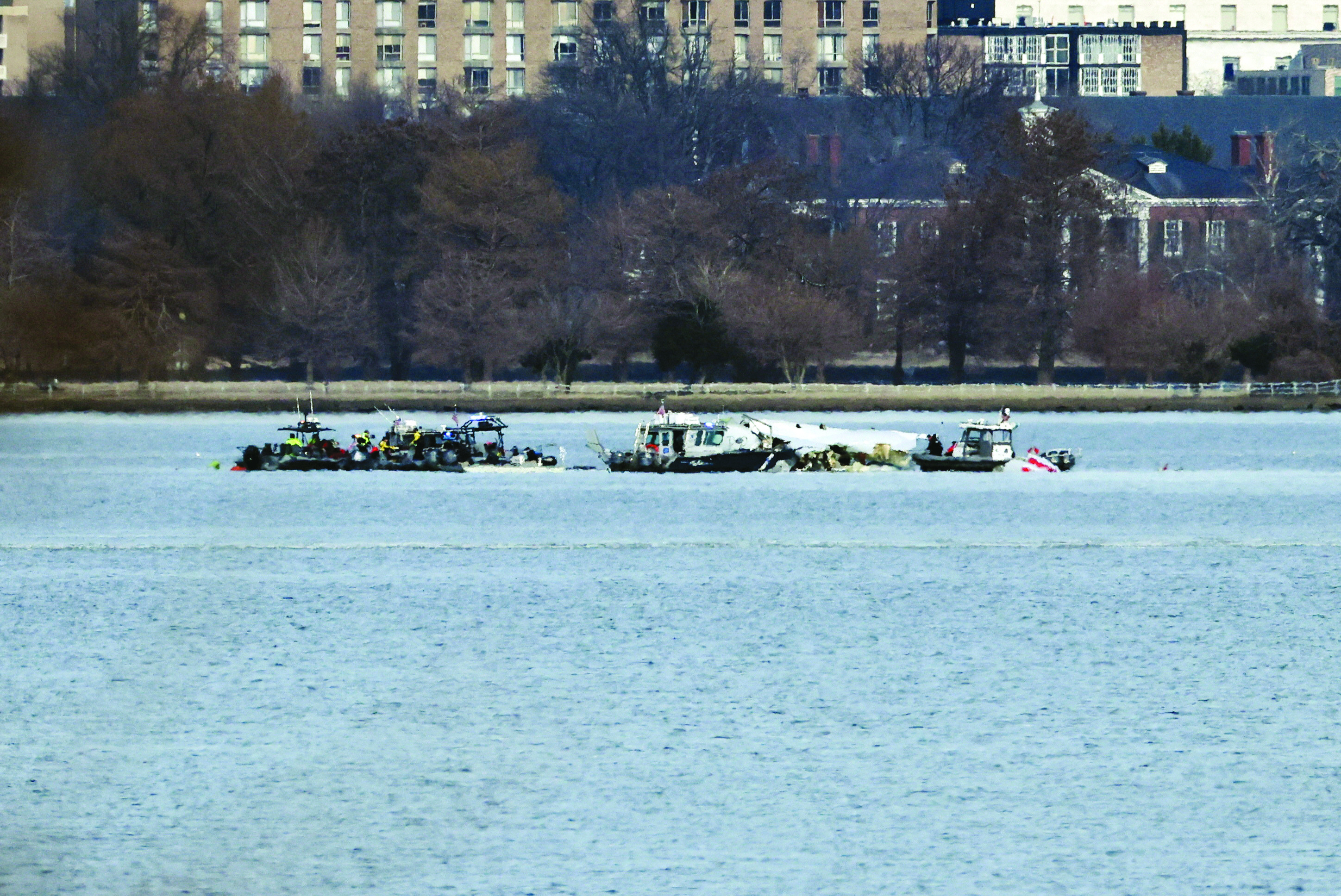 emergency workers carry out a search operation in the potomac river after the air crash in washington photo reuters