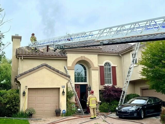 firefighters stand on top of a house with holes in the roof photo by ventura county fire department posted on x photo afp firefighters stand on top of a house with holes in the roof photo by ventura county fire department posted on x photo afp