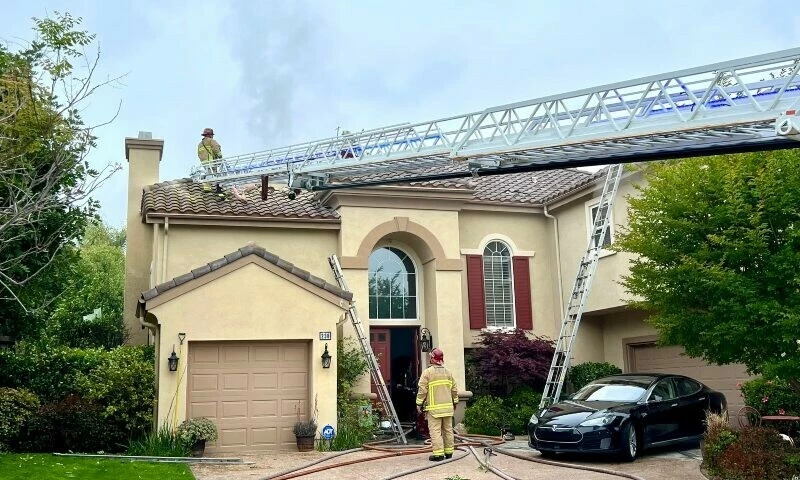 firefighters stand on top of a house with holes in the roof photo by ventura county fire department posted on x photo afp firefighters stand on top of a house with holes in the roof photo by ventura county fire department posted on x photo afp