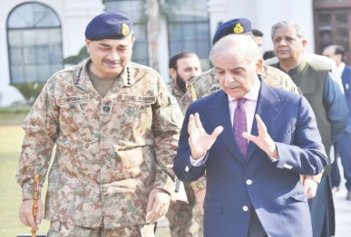 prime minister shehbaz sharif speaks with chief of army staff and chief of defence forces field marshal syed asim munir during a ghq visit in rawalpindi