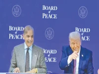 us president donald trump shares a lighter moment with prime minister shehbaz sharif during the unveiling of the board of peace on the sidelines of the world economic forum annual meeting in davos photo express