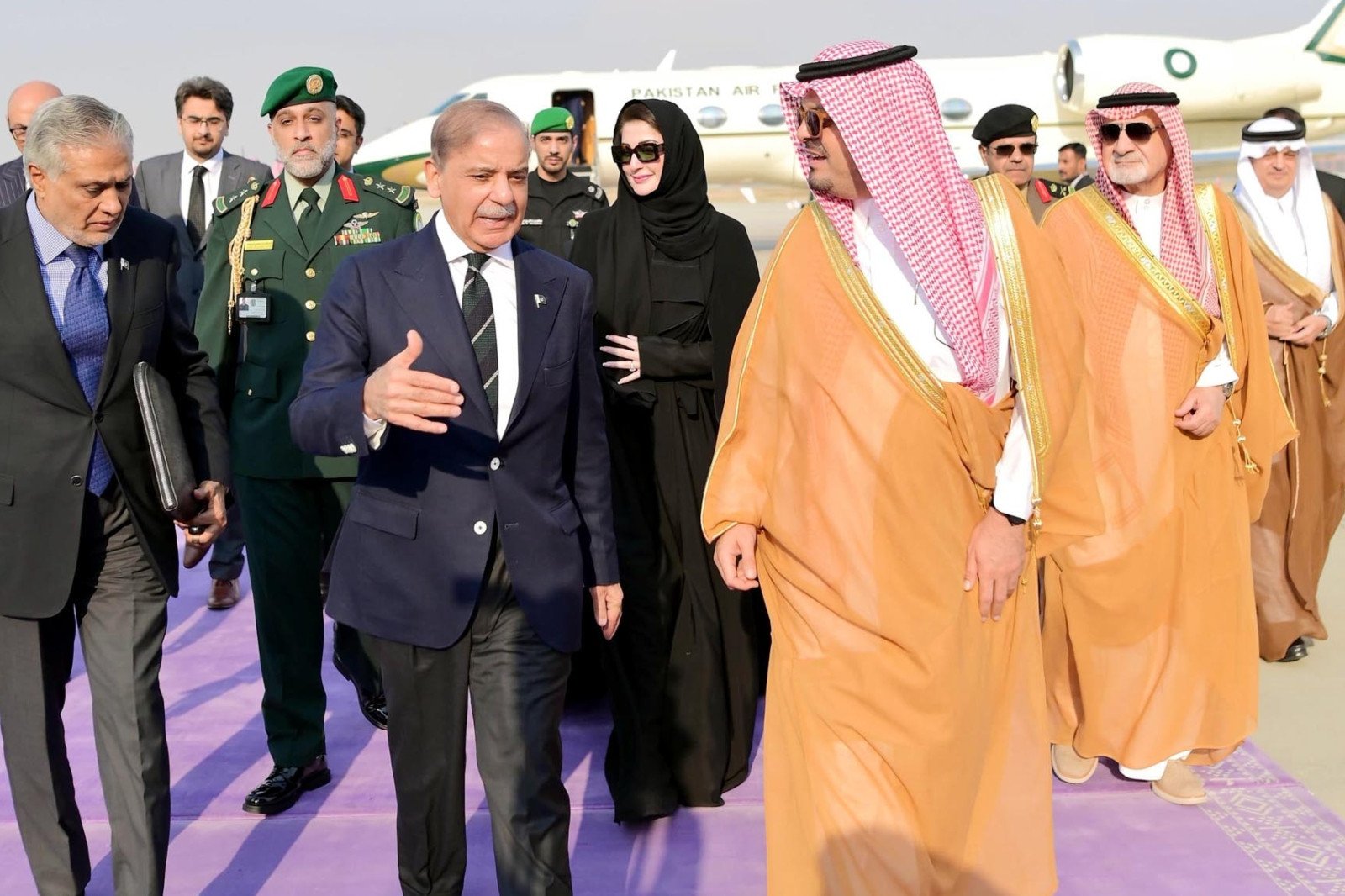 deputy governor of makkah prince saud bin mashal bin abdul aziz al saud welcomes prime minister shehbaz sharif upon his arrival in jeddah on march 19 2025 photo pid