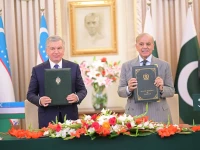 prime minister muhammad shehbaz sharif and the uzbek president pose after signing a protocol to boost bilateral trade between pakistan and uzbekistan to 2bn annually on thursday photo x