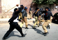 men in lawyers robes assault police