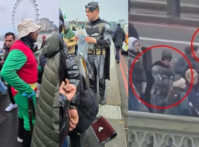 london officers disguised as batman and robin take down illegal gambling operation