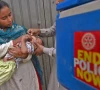 a health worker administers polio vaccine drops to a child during a door to door polio vaccination campaign in lahore pakistan photo afp