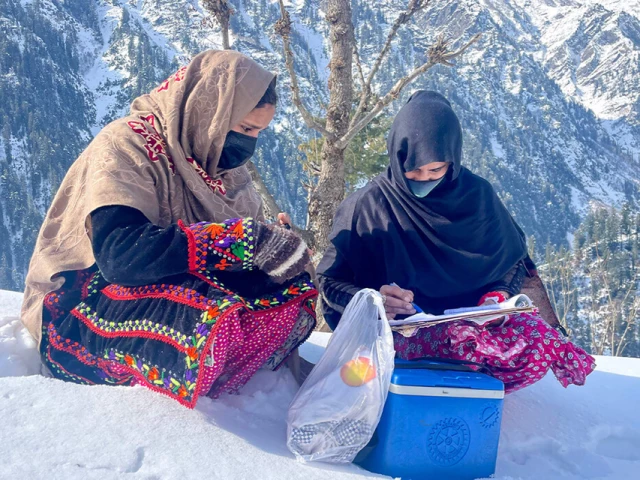health workers sit on snow during a polio vaccination drive in azad jammu kashmir s neelum valley on february 4 2025 photo afp health workers sit on snow during a polio vaccination drive in azad jammu kashmir s neelum valley on february 4 2025 photo afp