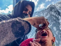 a health worker administers polio drops to a child during a door to door vaccination campaign amidst heavy snow in the bakwali surgan area of azad jammu kashmir s neelum valley on february 4 2025 afp a health worker administers polio drops to a child during a door to door vaccination campaign amidst heavy snow in the bakwali surgan area of azad jammu kashmir s neelum valley on february 4 2025 afp