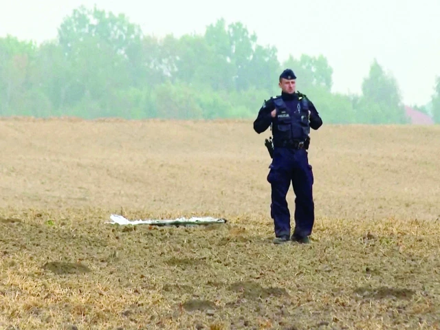 a polish police officer stands near an unmanned aerial vehicle fragment in czesniki poland russian drones violated polish airspace during an attack on ukraine and some were shot down by poland photo reuters a polish police officer stands near an unmanned aerial vehicle fragment in czesniki poland russian drones violated polish airspace during an attack on ukraine and some were shot down by poland photo reuters